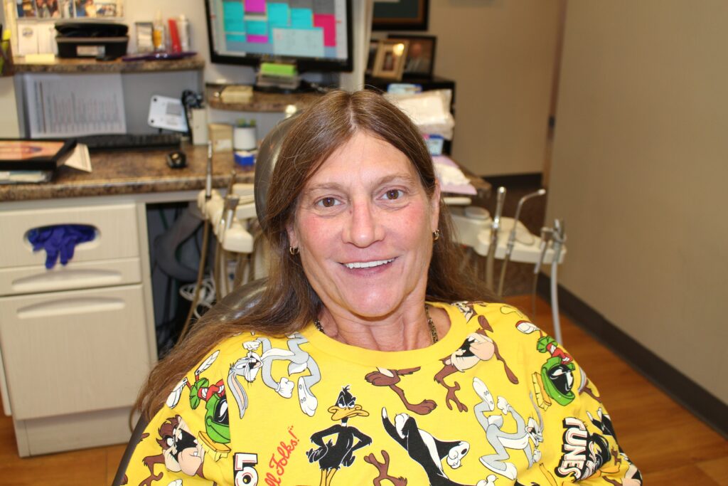Patient smiling after receiving dental implants in Bridgeville, PA